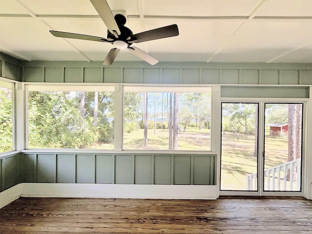 unfurnished sunroom with ceiling fan and a healthy amount of sunlight