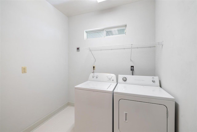 clothes washing area featuring independent washer and dryer