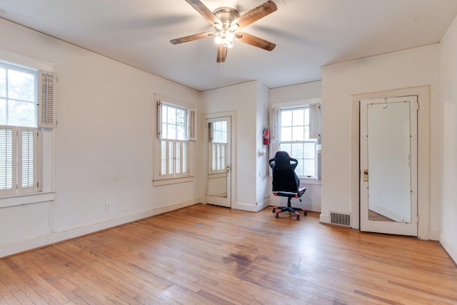 interior space with ceiling fan and light hardwood / wood-style floors