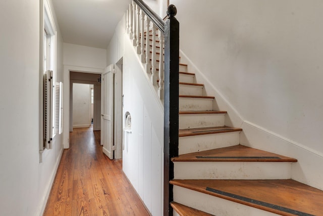 stairway featuring wood-type flooring