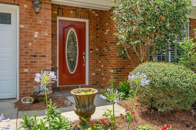 2031 Windsor Oaks Ct, Tallahassee, FL 32308 - doorway to property featuring brick siding and a garage