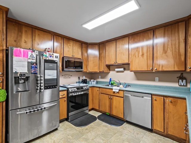 kitchen featuring appliances with stainless steel finishes and sink