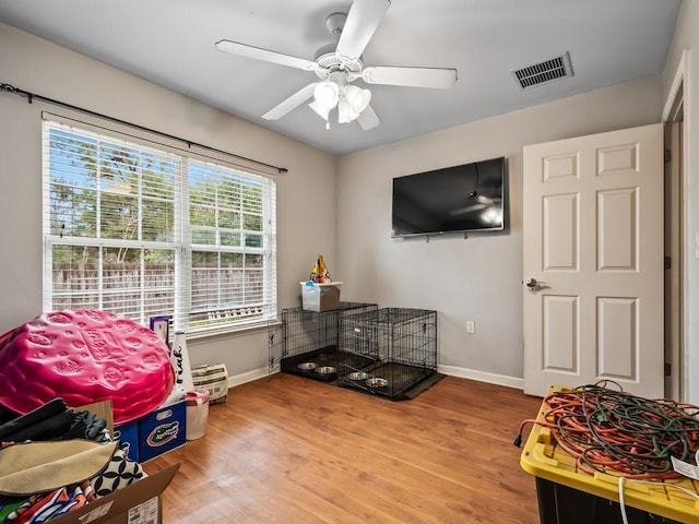 miscellaneous room with ceiling fan and wood-type flooring