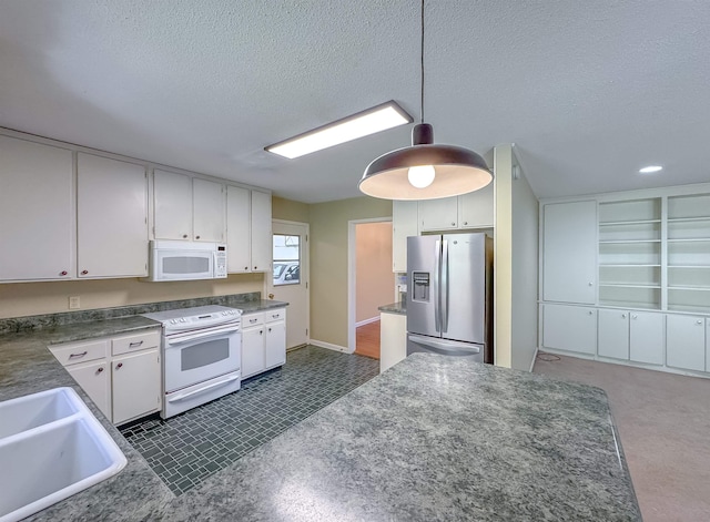 kitchen featuring a textured ceiling, white appliances, a sink, white cabinetry, and dark countertops