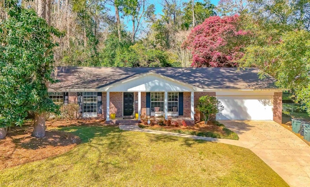 single story home with a garage, driveway, brick siding, and a front yard