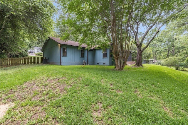 rear view of property featuring central AC