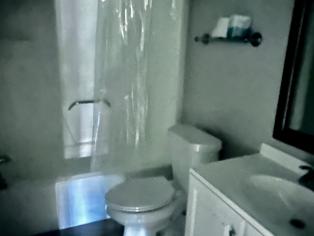 255 N Villas Ct Unit 1, Tallahassee, FL 32303 - full bathroom with vanity, shower / bath combination with curtain, and toilet