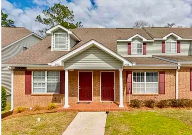 view of front of home with a front lawn