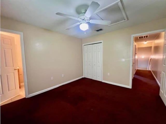 unfurnished bedroom featuring a closet, ceiling fan, and dark carpet