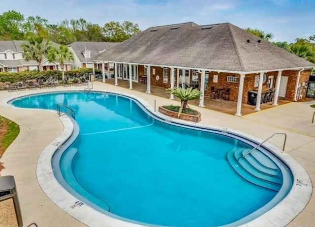 view of swimming pool with a patio