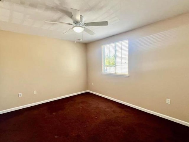 spare room with ceiling fan