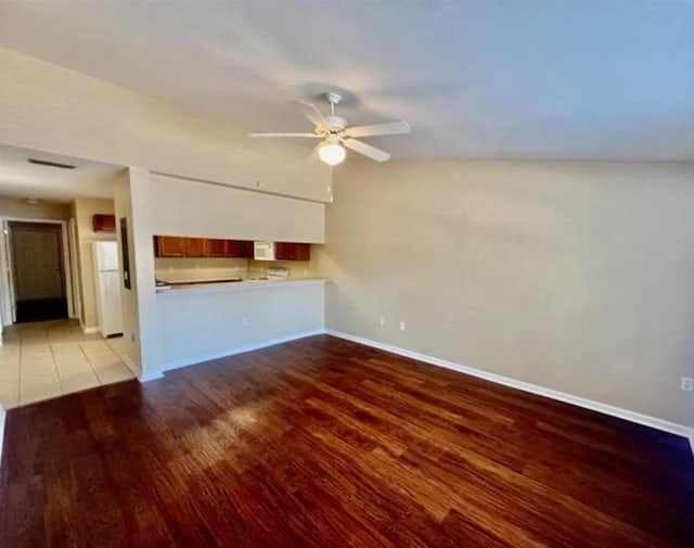 unfurnished living room with ceiling fan and light wood-type flooring