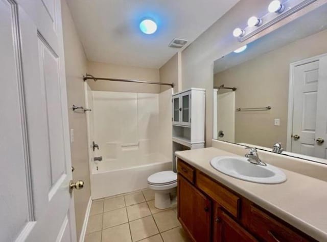 full bathroom with toilet, washtub / shower combination, tile patterned flooring, and vanity