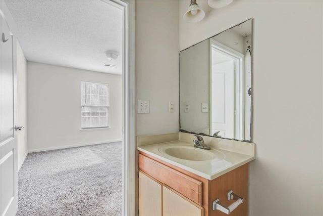 3000 S Adams St Unit 113, Tallahassee, FL 32301 - bathroom featuring vanity and a textured ceiling
