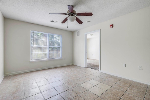 3000 S Adams St Unit 113, Tallahassee, FL 32301 - spare room with ceiling fan, light tile patterned floors, a textured ceiling, and baseboards
