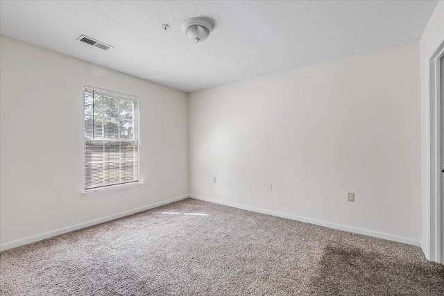 3000 S Adams St Unit 113, Tallahassee, FL 32301 - carpeted empty room with a textured ceiling and baseboards