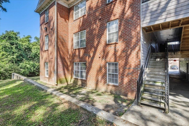 3000 S Adams St Unit 113, Tallahassee, FL 32301 - view of property exterior with stairway and brick siding