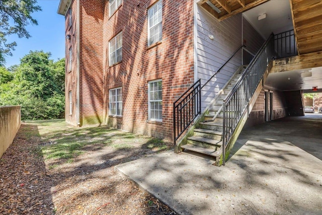 3000 S Adams St Unit 113, Tallahassee, FL 32301 - view of property exterior featuring brick siding and stairs
