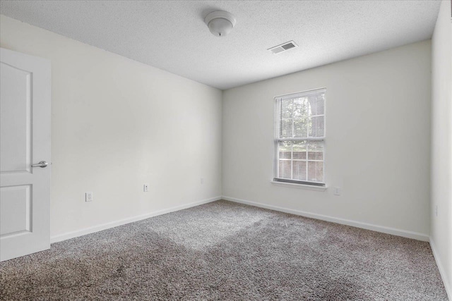 3000 S Adams St Unit 113, Tallahassee, FL 32301 - carpeted empty room with a textured ceiling and baseboards