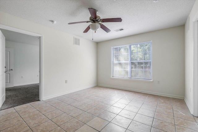 3000 S Adams St Unit 113, Tallahassee, FL 32301 - spare room with ceiling fan, a textured ceiling, light tile patterned floors, a smoke detector, and baseboards
