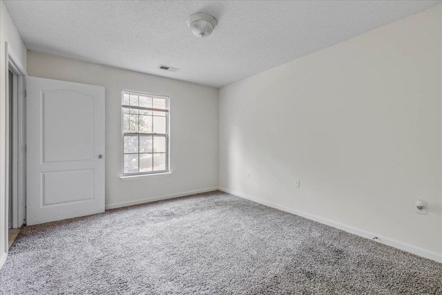 3000 S Adams St Unit 113, Tallahassee, FL 32301 - spare room with carpet, a textured ceiling, and baseboards