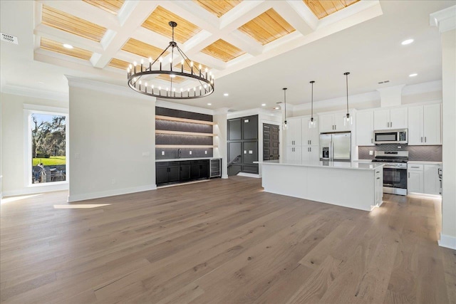 275 S Franklin Blvd Unit 4, Tallahassee, FL 32301 - unfurnished living room featuring ornamental molding, wood finished floors, a chandelier, coffered ceiling, and beamed ceiling