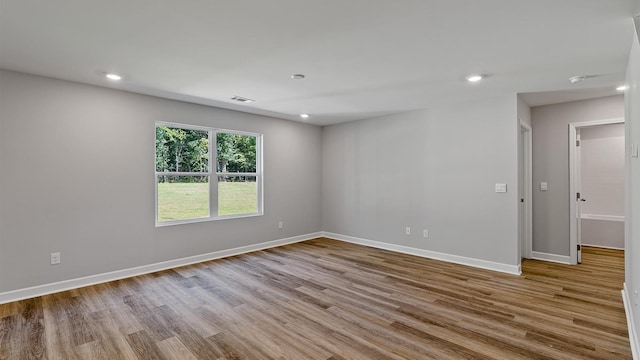 spare room featuring light hardwood / wood-style flooring