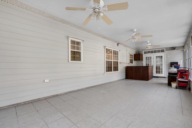 view of patio featuring ceiling fan and french doors