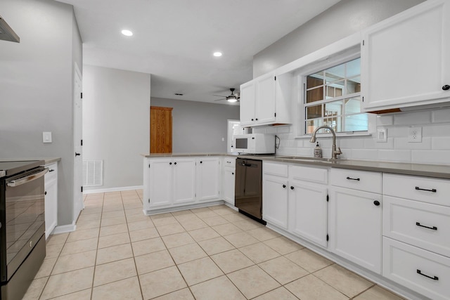 kitchen featuring electric stove, sink, white cabinetry, and dishwasher