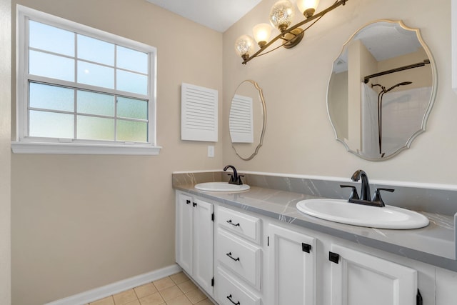 bathroom with vanity and tile patterned floors