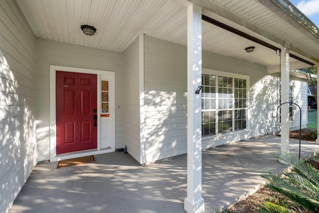 entrance to property featuring a porch