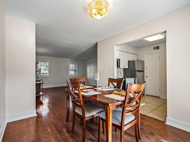 dining area featuring wood-type flooring