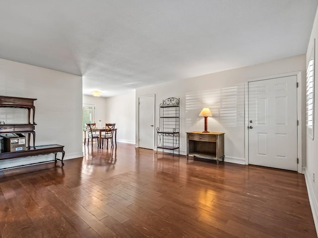 foyer entrance with dark hardwood / wood-style floors