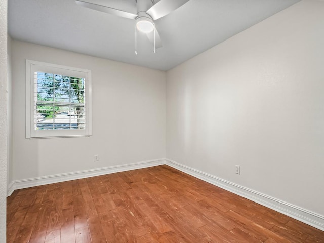 spare room featuring ceiling fan and wood-type flooring