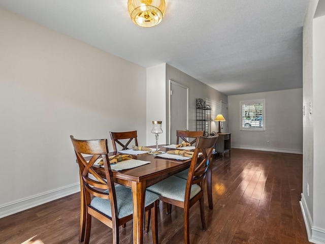 dining room with dark hardwood / wood-style floors