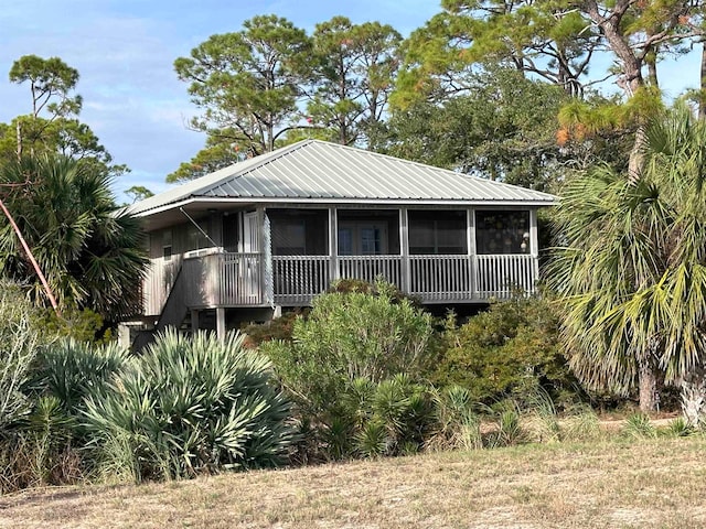 view of front facade with a sunroom