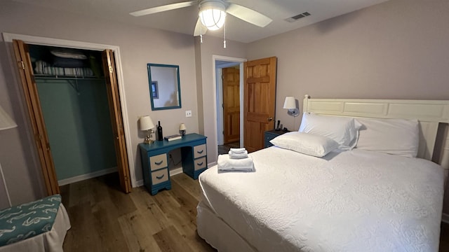 bedroom featuring hardwood / wood-style floors, ceiling fan, and a closet