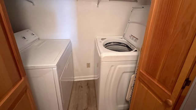 washroom with washing machine and dryer