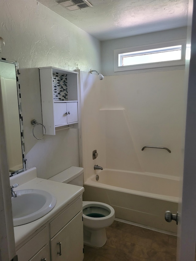 full bathroom featuring vanity, toilet, and shower / washtub combination