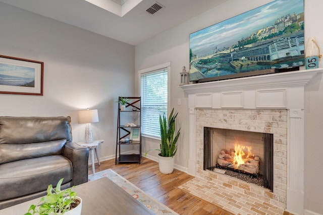 3524 Rosemont Ridge Rd, Tallahassee, FL 32312 - living room with light wood finished floors and a fireplace