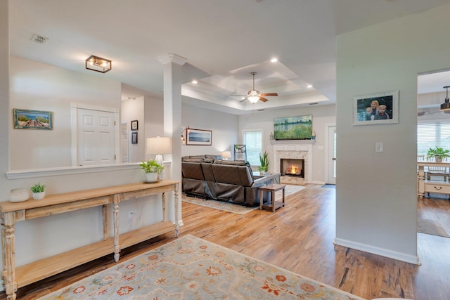 3524 Rosemont Ridge Rd, Tallahassee, FL 32312 - living area featuring a tray ceiling, wood finished floors, a ceiling fan, a fireplace with flush hearth, and recessed lighting