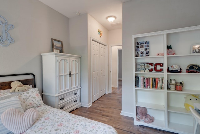 3524 Rosemont Ridge Rd, Tallahassee, FL 32312 - bedroom featuring wood finished floors and a closet
