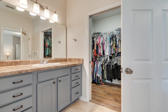 3524 Rosemont Ridge Rd, Tallahassee, FL 32312 - bathroom featuring vanity, a spacious closet, and tile patterned floors
