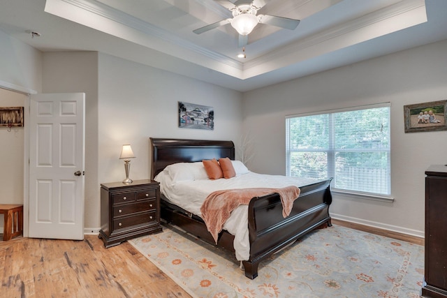 3524 Rosemont Ridge Rd, Tallahassee, FL 32312 - bedroom featuring ornamental molding, light wood finished floors, a tray ceiling, and a ceiling fan