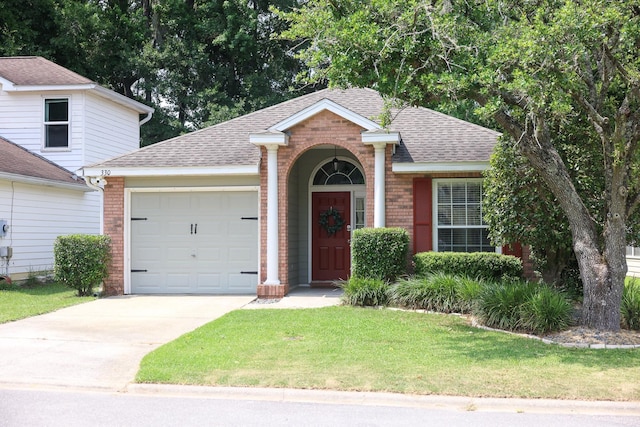 330 Dreadnaught Ct, Tallahassee, FL 32312 - view of front of house featuring brick siding, an attached garage, a shingled roof, and a front yard