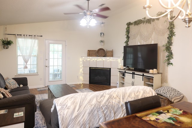 330 Dreadnaught Ct, Tallahassee, FL 32312 - living area featuring a fireplace, wood finished floors, a ceiling fan, vaulted ceiling, and baseboards