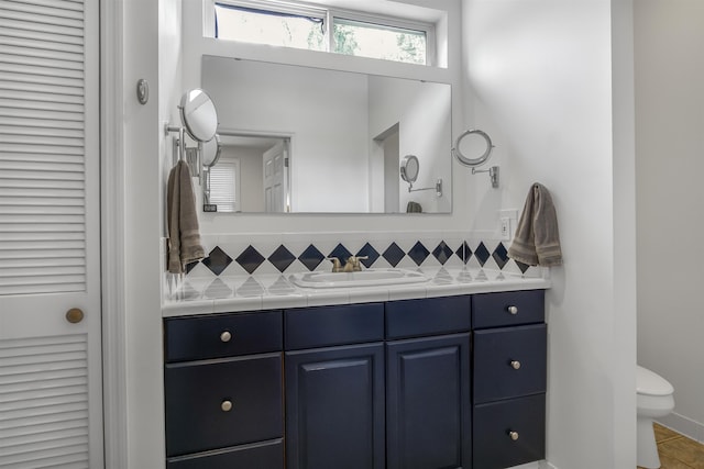 1324 Branch St, Tallahassee, FL 32303 - bathroom with vanity, decorative backsplash, and a closet