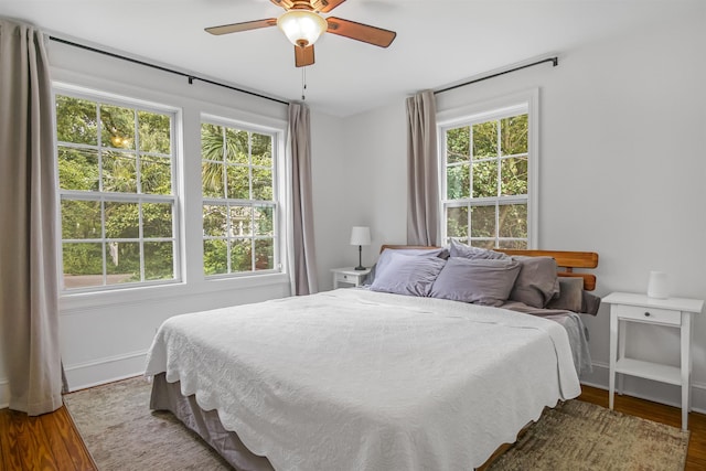 1324 Branch St, Tallahassee, FL 32303 - bedroom with multiple windows, wood finished floors, and ceiling fan