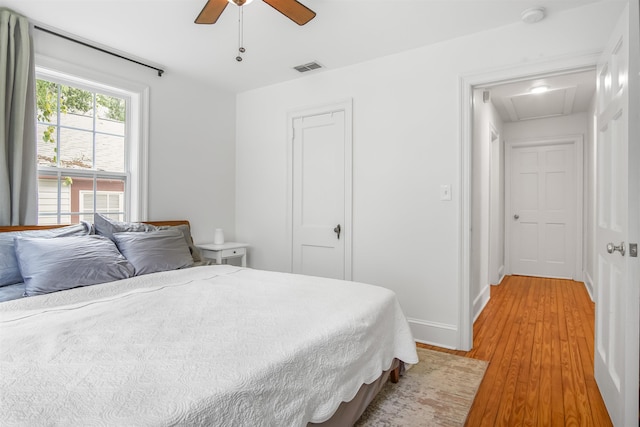 1324 Branch St, Tallahassee, FL 32303 - bedroom with light wood-style floors, a closet, ceiling fan, and baseboards