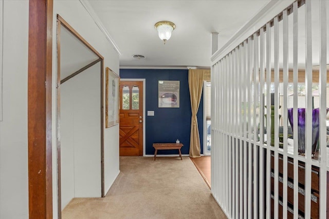 hallway featuring light carpet and crown molding